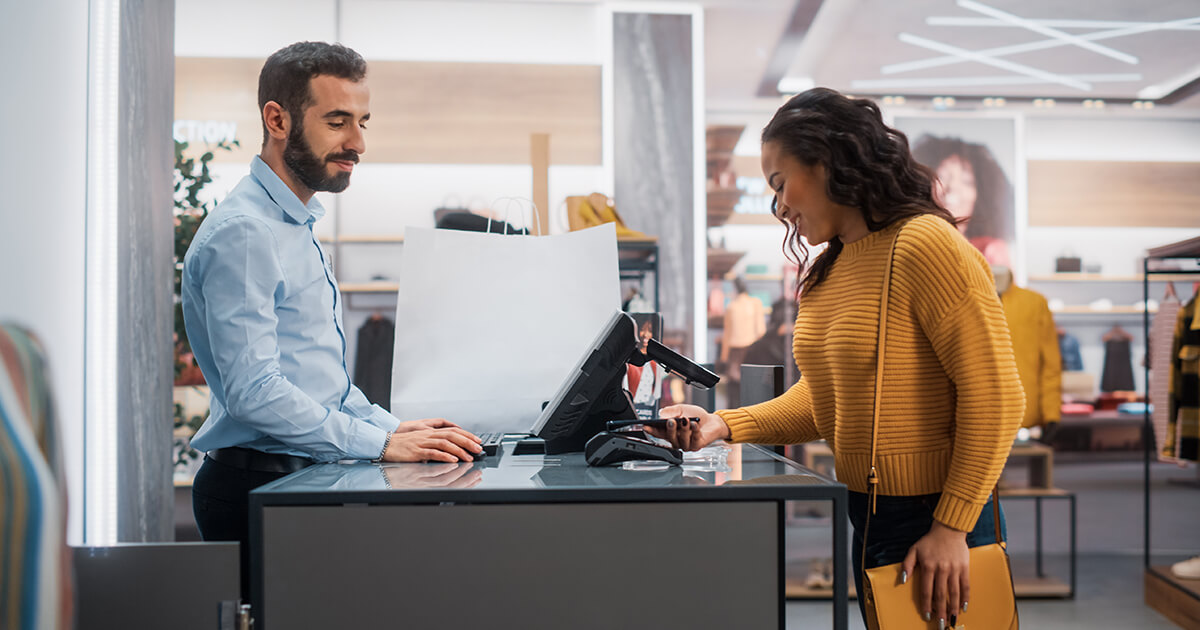 customer pays at checkout in a store