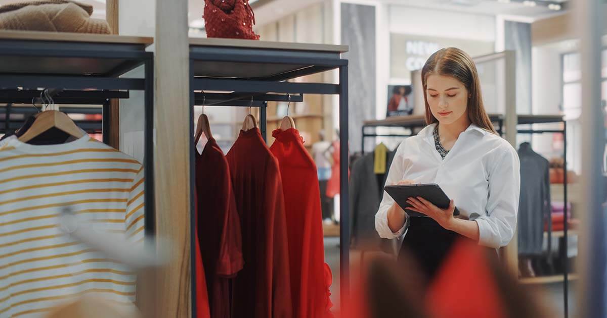 retail associate using tablet to check inventory