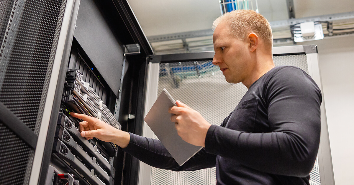 technician working in network cabinet