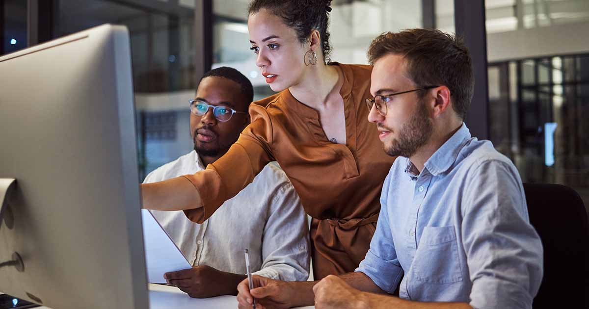 IT help desk team working together to address help desk problems