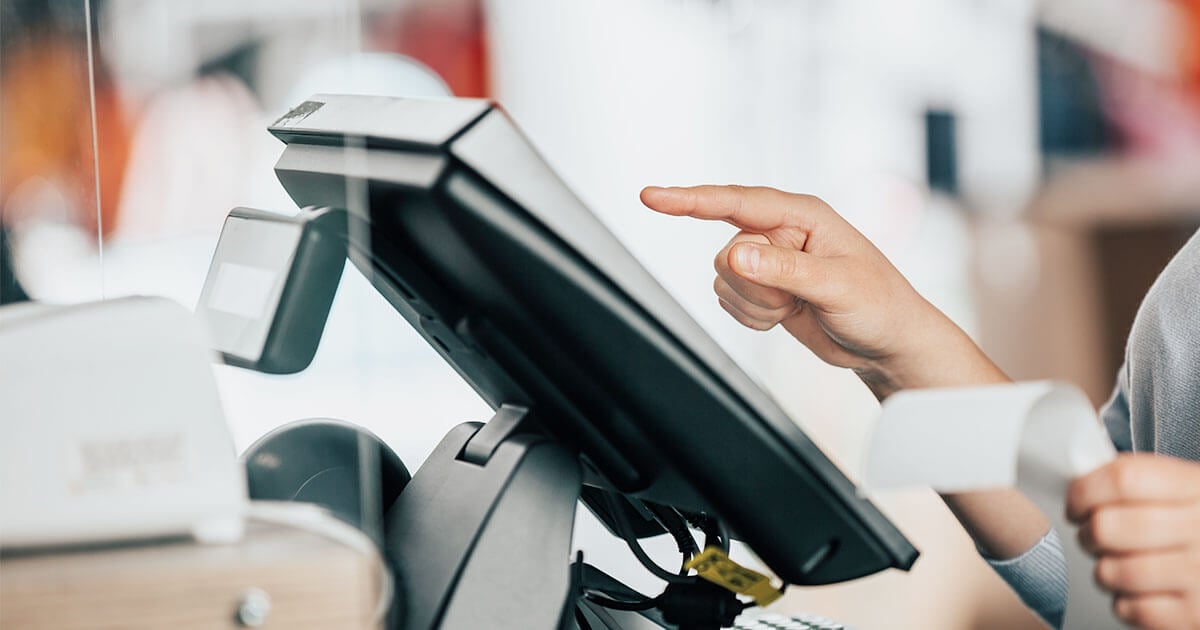 employee using retail IT at point of sale